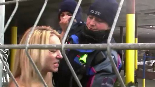 Topless trio target Davos forum in feminist protest