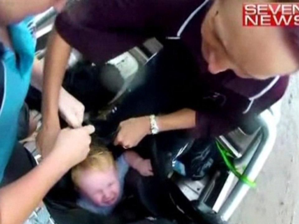 Rescuers winch toddler to safety amid food deluge