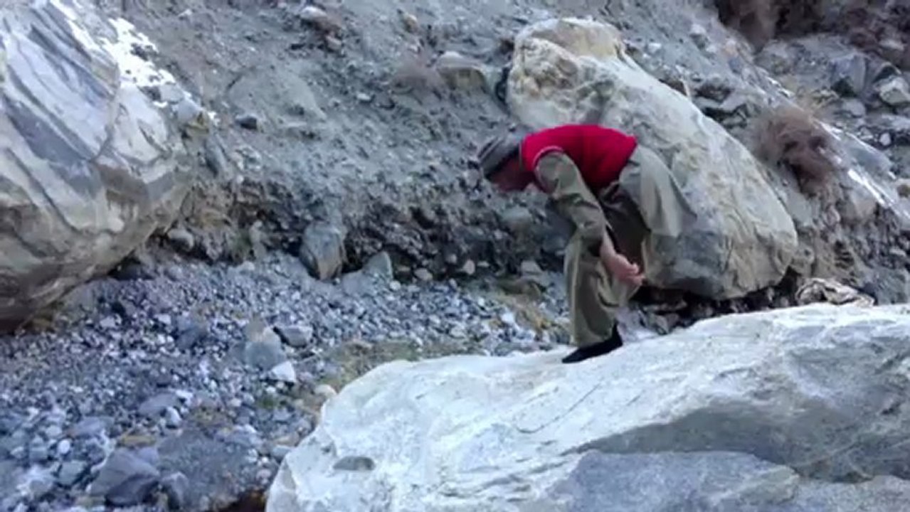 Nawaz offering his prayer on a rock
