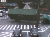 Motorcyclist Narrowly Escapes Overturning Truck in China