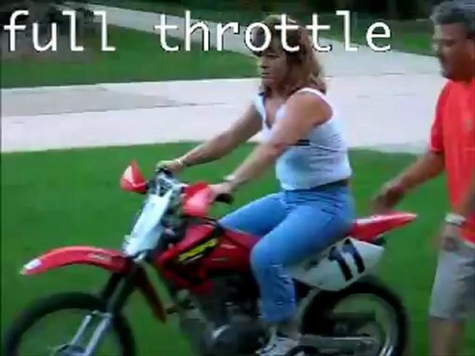 Woman falls off dirtbike