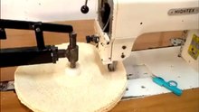 Industrial sewing machine for extra thick spiral sewn buffing wheel