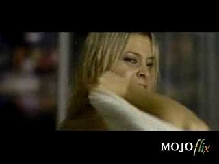 Woman Putting On Bra