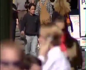 Mehran Muslimim walking down a city street