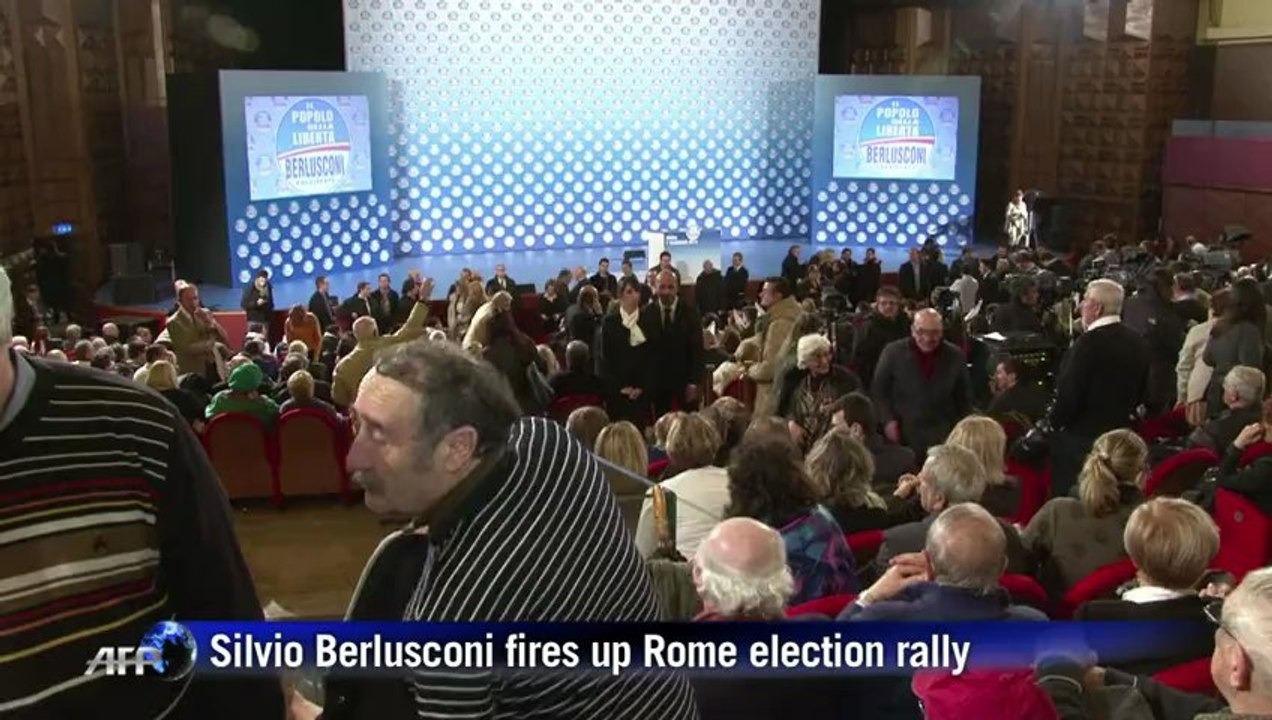 Berlusconi the showman fires up Rome election rally