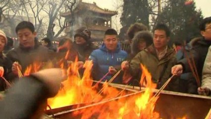 Chinese pray on first day of Year of the Snake