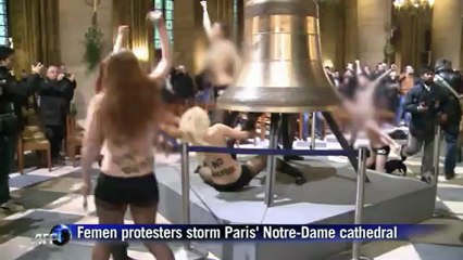 Topless women celebrate pope's resignation