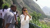Pregnant Kim Kardashian Shows Off Her Kurves in Sheer Plunging Tops