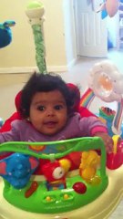 baby loving her bouncer