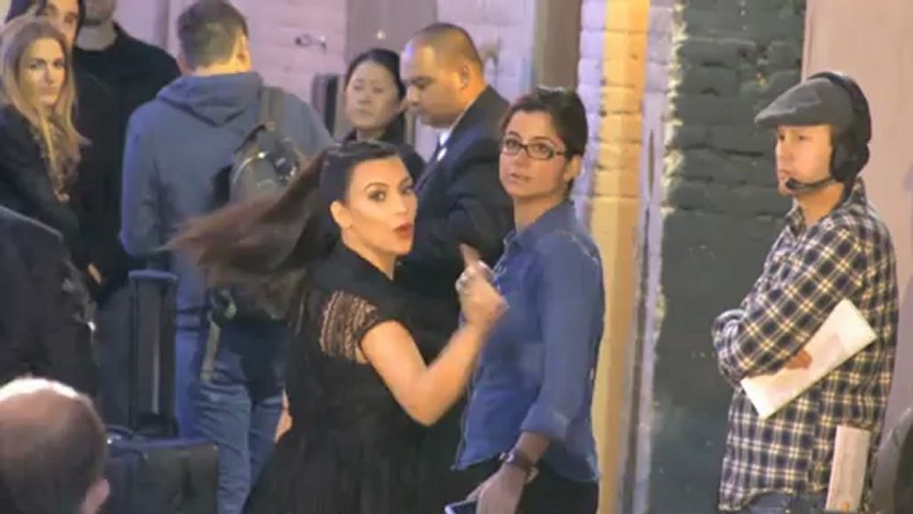 Kim Kardashian Covers Her Baby Bump in Feathers