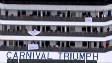"SOS" signs visible as cruise ship approaches Alabama coast