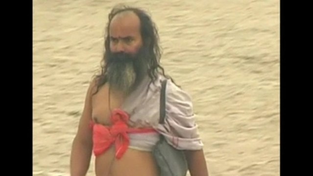 Kumbh Mela attendees bath in the Ganges