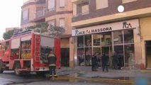 Woman sets herself alight in Spanish bank