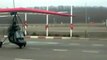 Hang glider soars into gas station to fill up