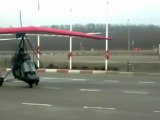 Hang glider soars into gas station to fill up