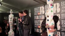 Mumford & Sons drunk at the Brit Awards 2013 Winner's Conference hugging giant statues