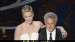 Actress Charlize Theron and actor Dustin Hoffman present onstage Oscars 2013