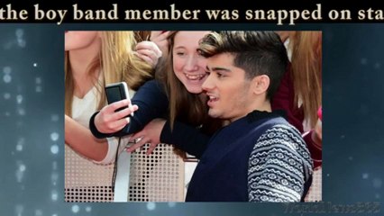 Zayn Malik crying on stage during One Direction's tour