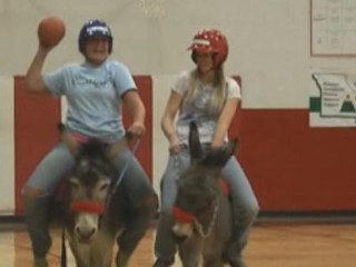 Raw: Students play basketball riding donkeys