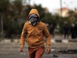Raw: Egyptian riot police fire tear gas