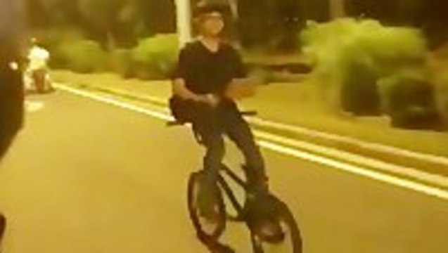 Texting While Cycling Backwards