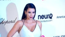 Kim Kardashian Flashes Her Bra as She Opens Up About 'Difficult' Pregnancy