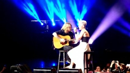 Pink interrupts concert to help crying girl