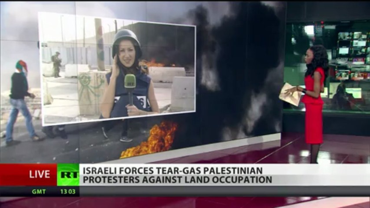 Stun grenades explode as Palestinians protest land confiscation by Israel