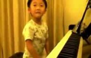 4 years old boy plays d piano like a pro.