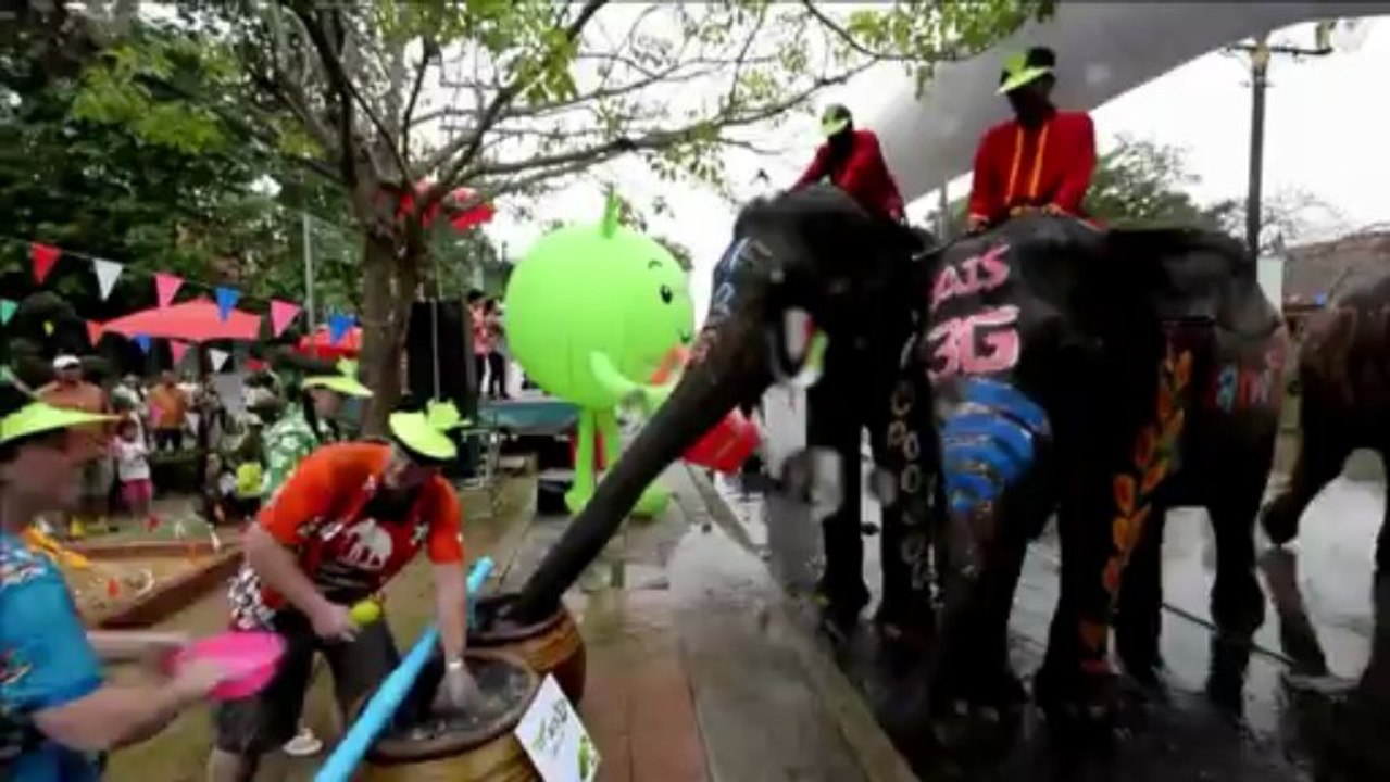 Elephants spray water for Thai New Year festival