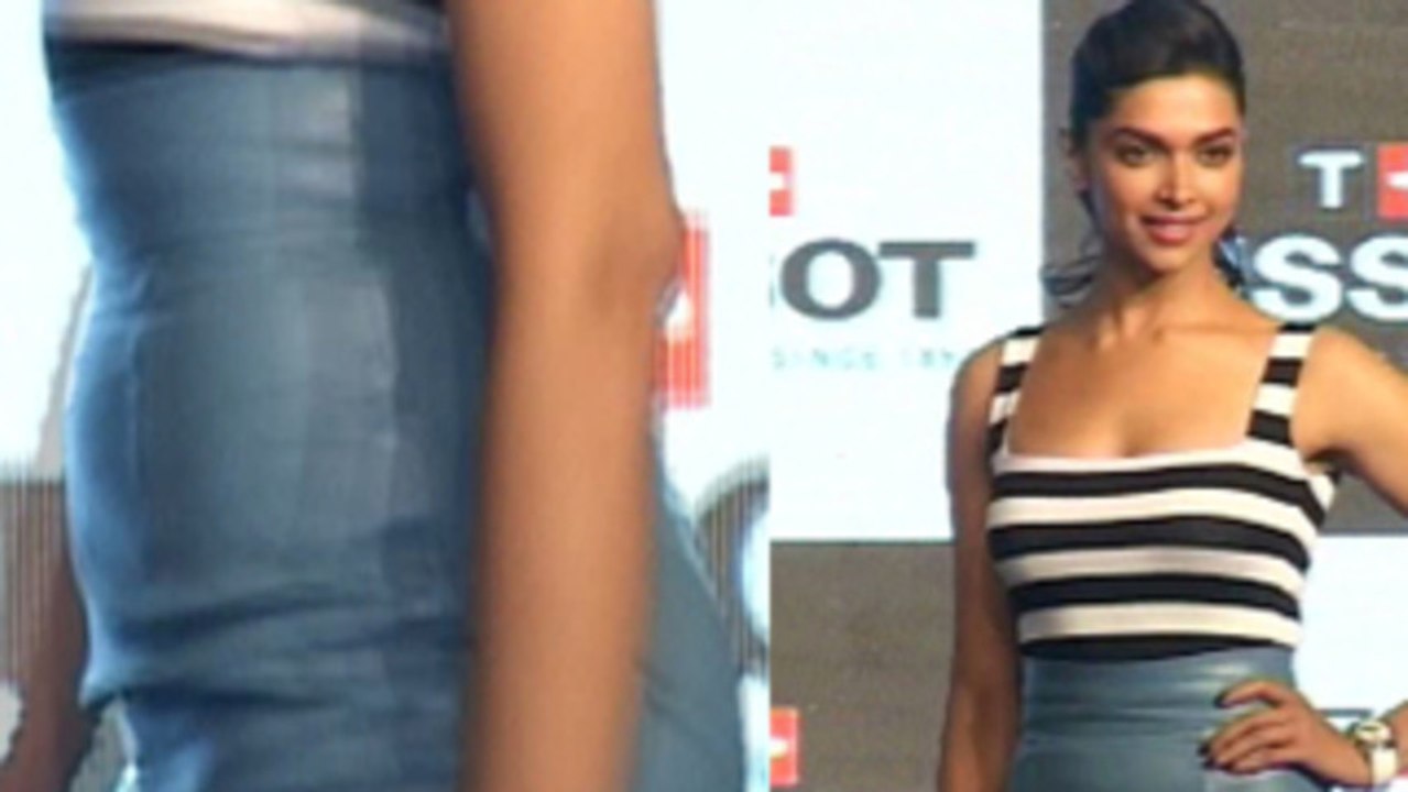 Deepika Padukone Pencil Skirt With A Striped Top And Graphic Pumps.