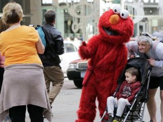 Cookie Monster, Elmo get in Times Square trouble