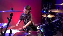 6 year old child playing Hot For Teacher on drums