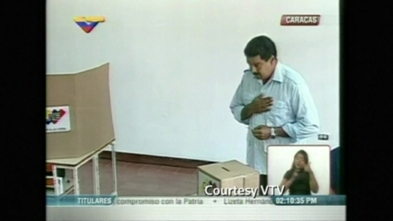 Venezuela's presidential frontrunner Maduro casts his ballot