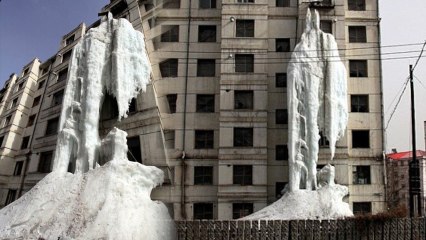 Man Creates 7 Story Ice Waterfall from Apartment Window