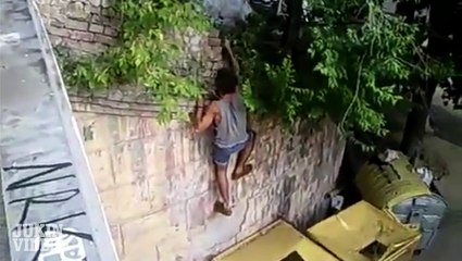 Guy Climbing Wall Falls in Yellow Bin JVDC