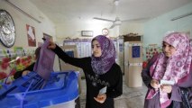 Iraqis defy violence, poll irregularity to vote