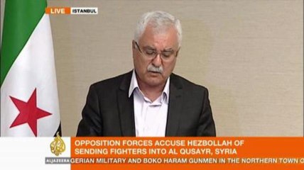 Syria's new interim chief denounces Assad