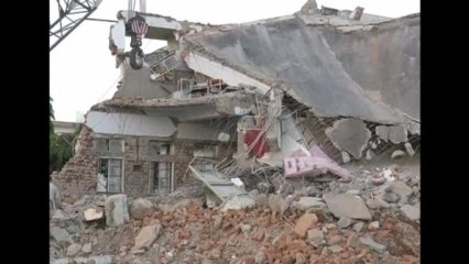 Collapsed hospital traps dozens