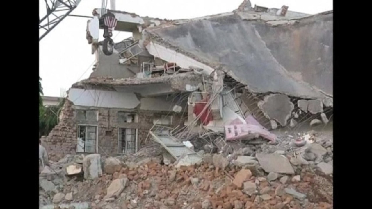 Collapsed hospital traps dozens