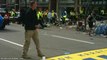 What is this guy holding  - Boston Marathon Bombing