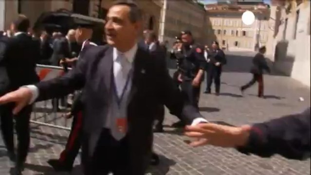 Police shot as Italy swears in new government