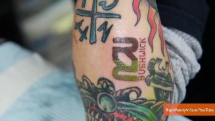 Real Estate Agency Employees Show Company Pride with Tattoos