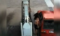 Women clings on to hose RIPPED from GUSHING petrol pump