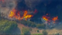 Growing wildfire near LA threatens homes