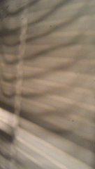 Wiggly Window Blind Shadow on Wall