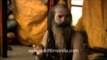 Indian holy man Naga Baba sits inside his tent in Varanasi