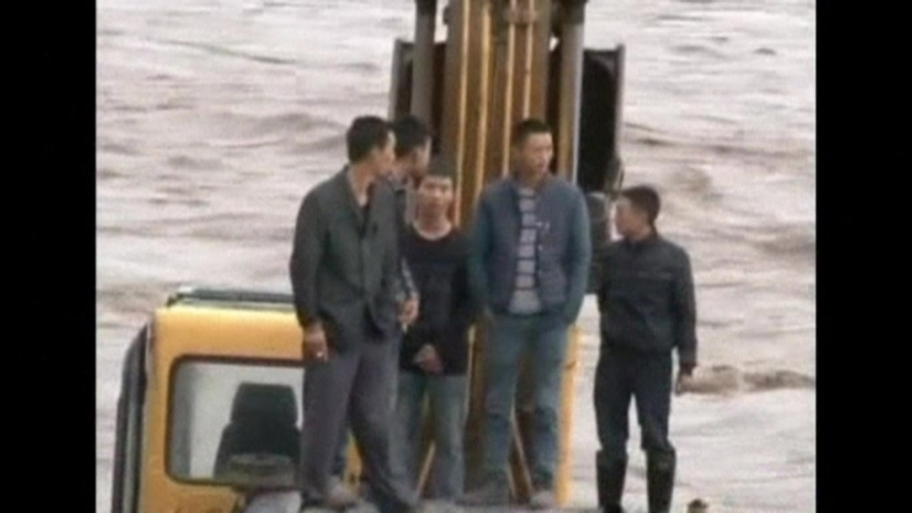 Five rescued from China flood