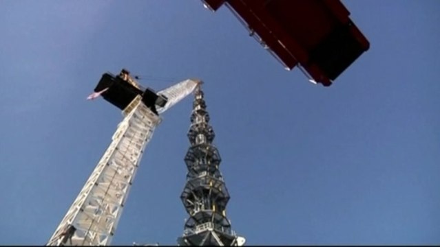 Spire rises in the ashes of Twin Towers in New York