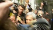 Chris Huhne mobbed by the press as he arrives home from prison